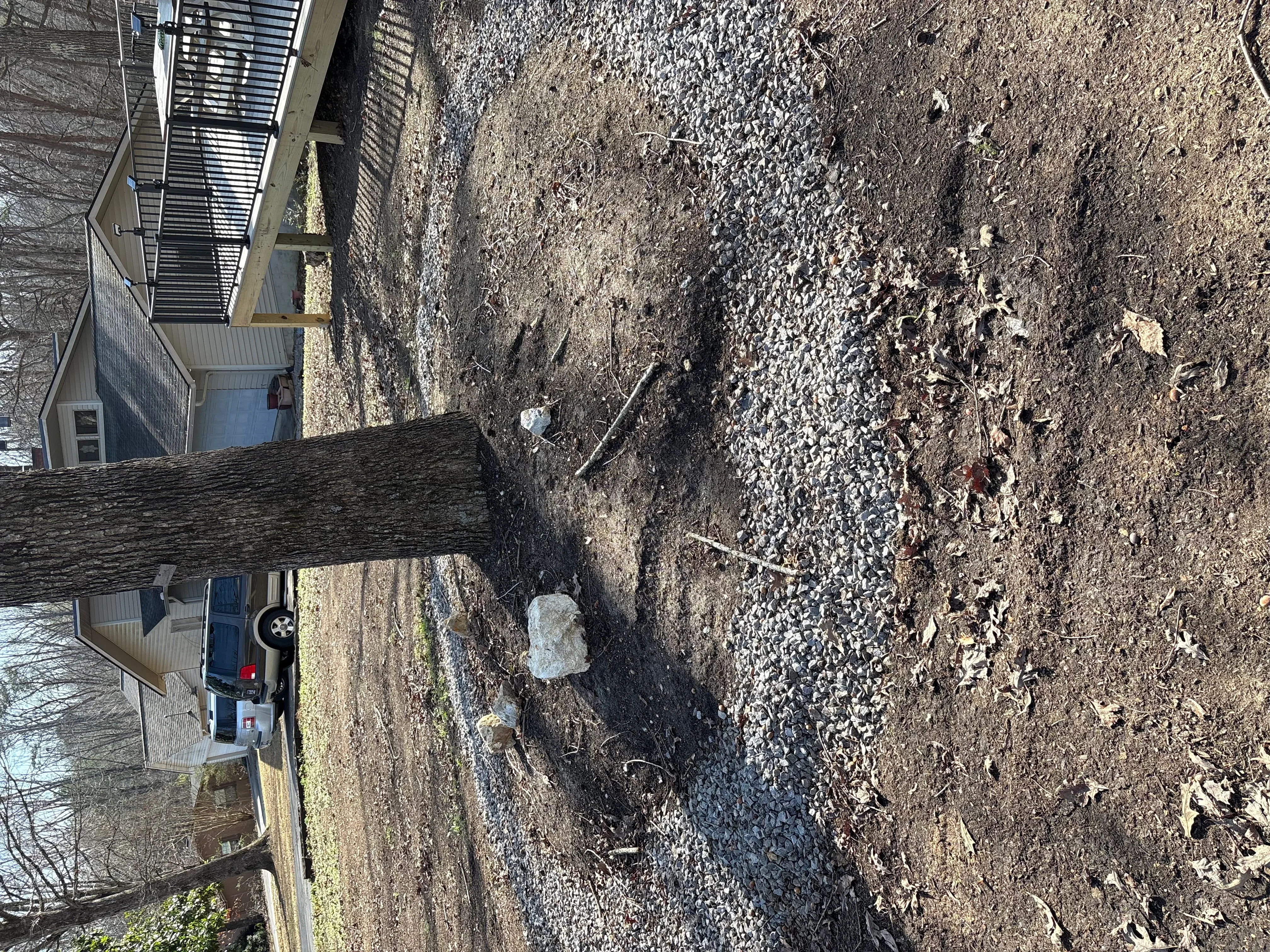 Damaged residential driveway with cracked and spalling concrete before repair