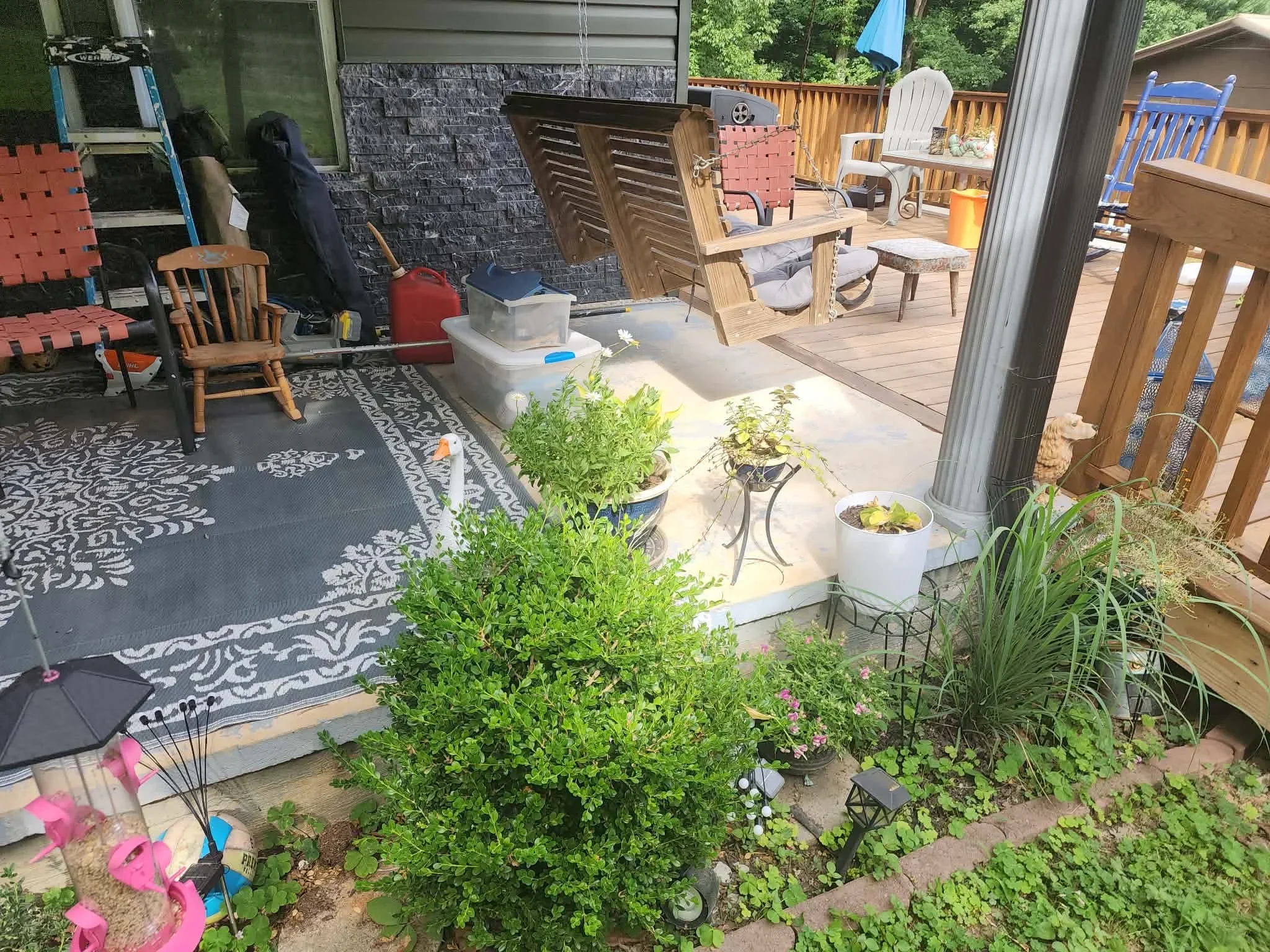Finished concrete patio with planter beds and landscape integration in residential backyard