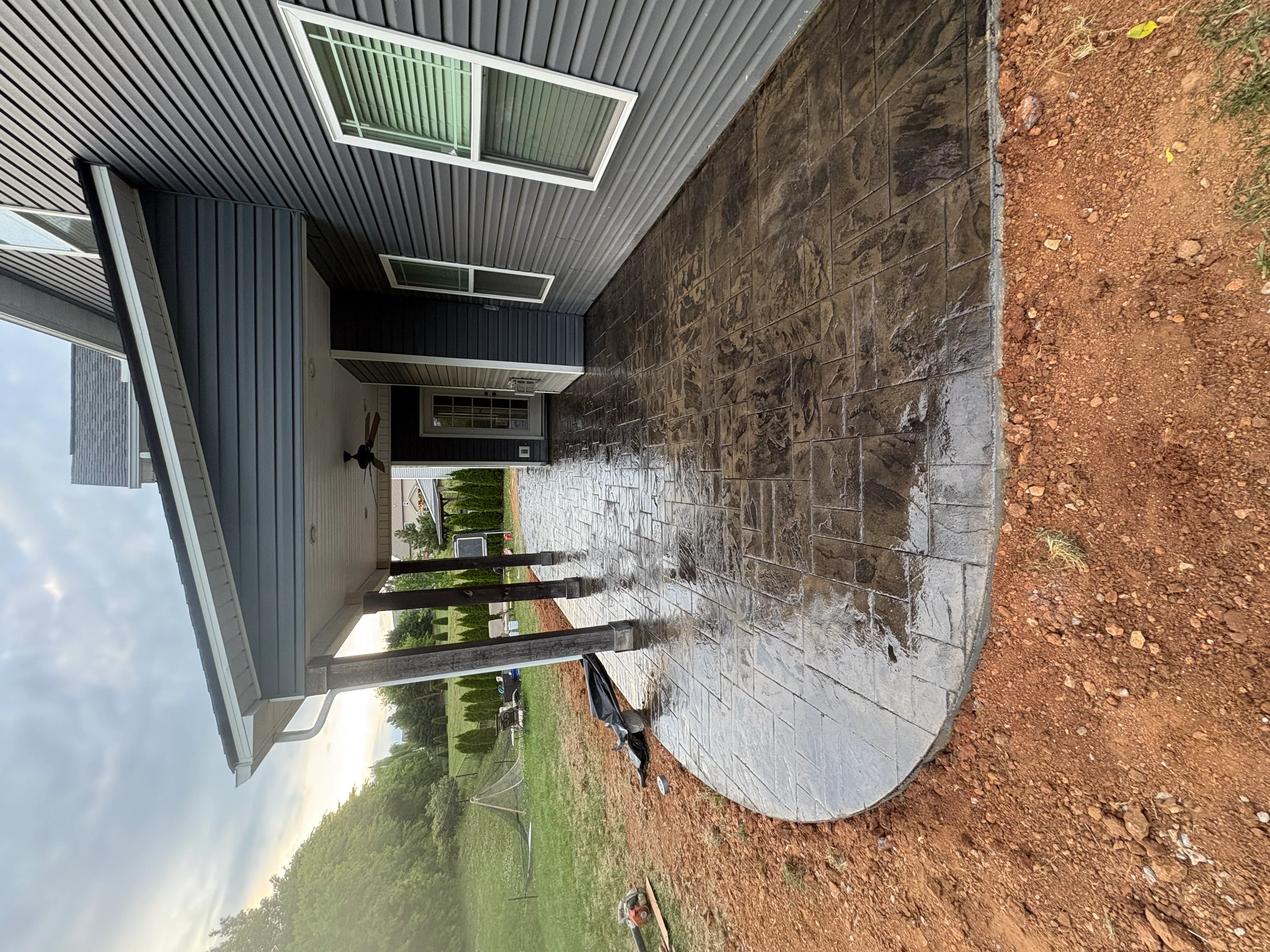 Finished concrete pad with metal roof structure and corrugated siding in Knoxville