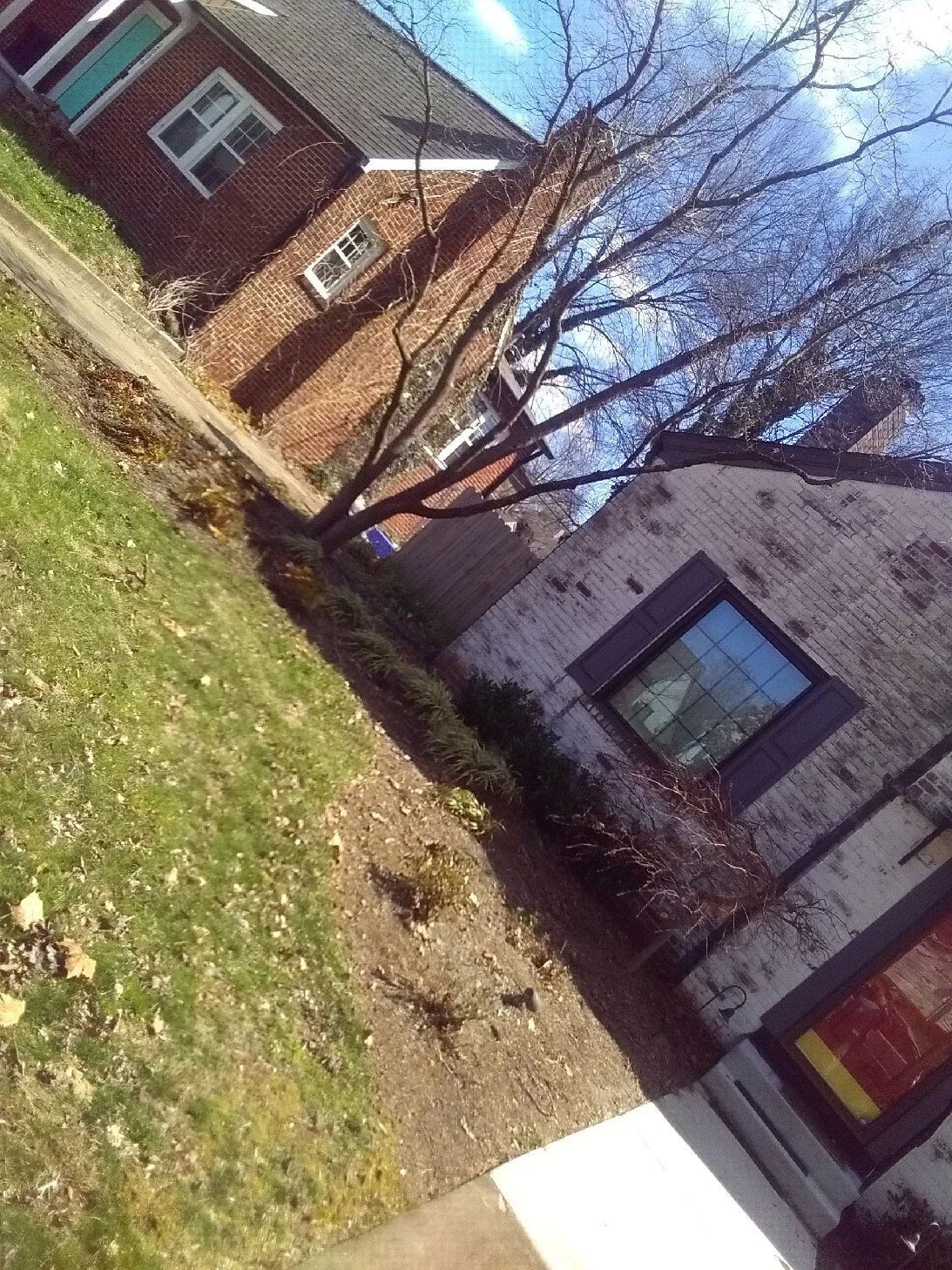 New concrete driveway and walkway at brick residential home in Knoxville