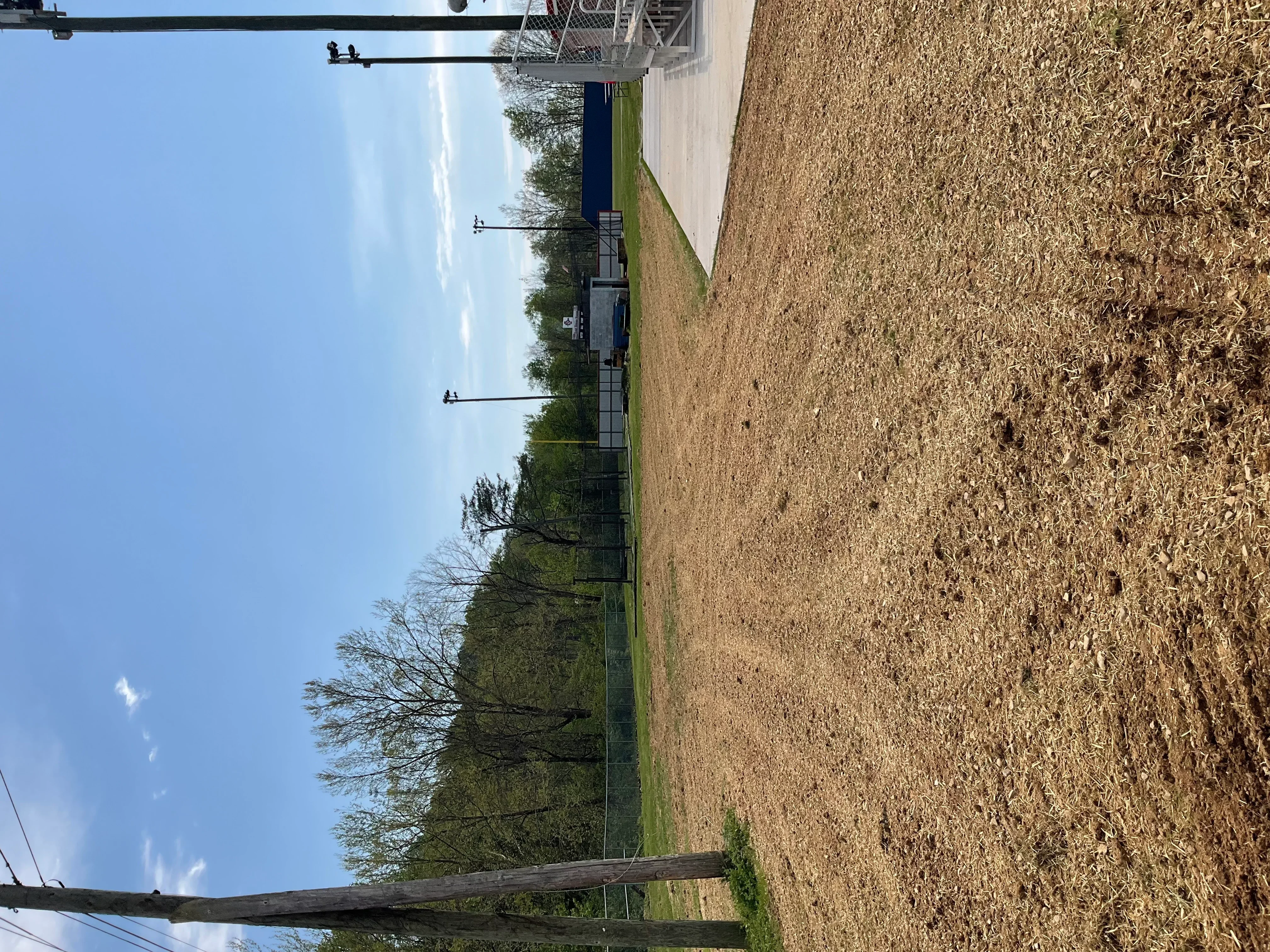 Newly installed concrete driveway with proper grading and finished edges in residential setting